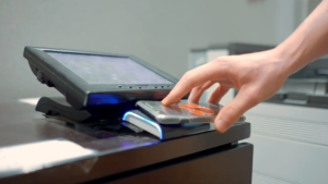 A student uses their mobile ID on Android at a printer
